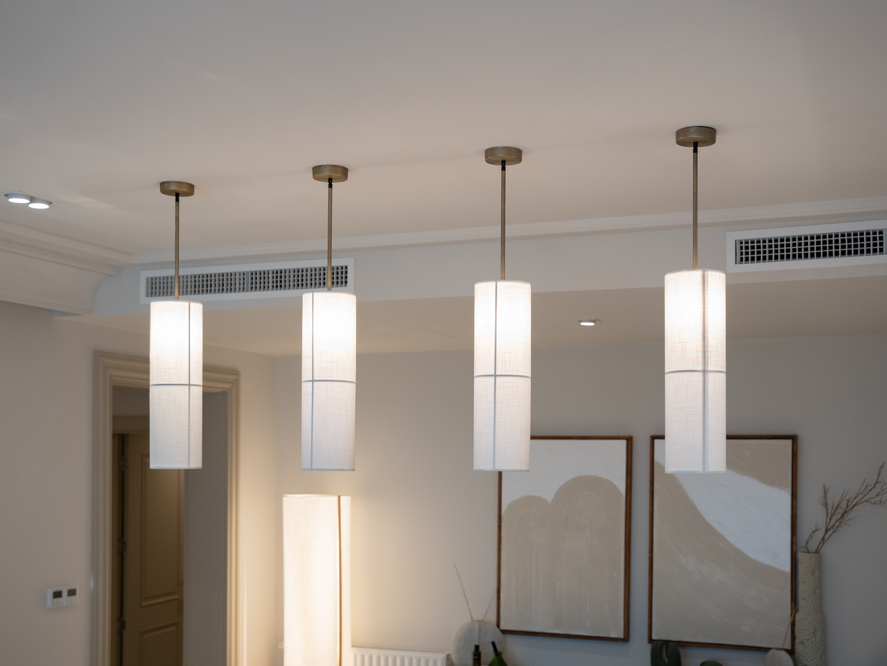 Modern ceiling lights add elegance and style to a minimalist interior space.